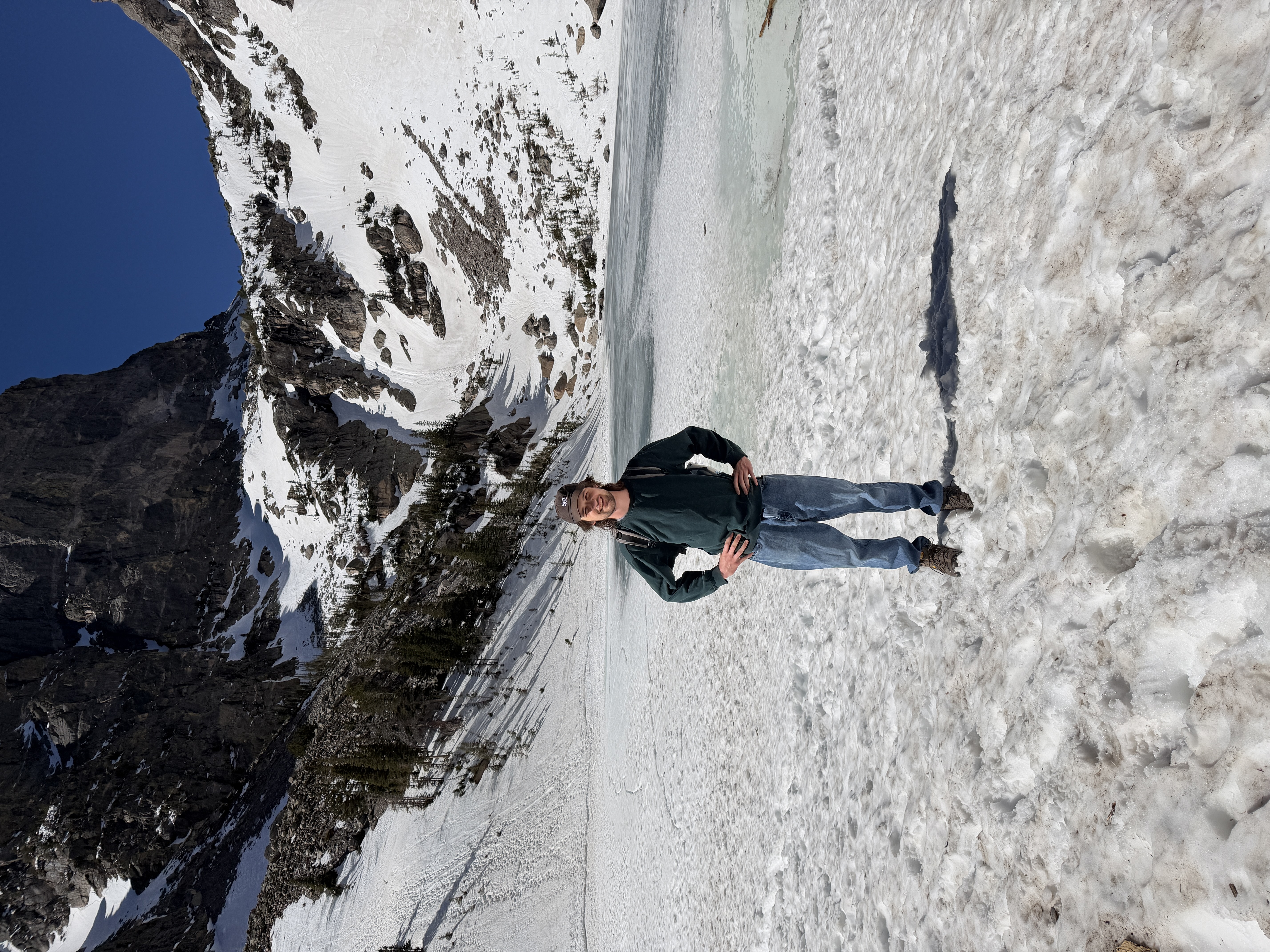 Caedmon standing in front of a frozen lake